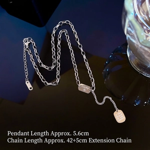 Titanium steel geometric tassel necklace with rectangular lucky charms on black background