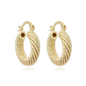 Vintage gold hollow twisted hoop earrings with textured rope design on white background