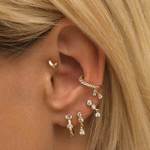 Detail of S925 sterling silver ear cuff and stud set with shimmering cubic zirconia