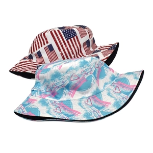 Reversible bucket hat with American flag print and pink heart graffiti for outdoor sun protection