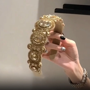 Vintage champagne gold headband with oversized crystals and intricate beadwork design