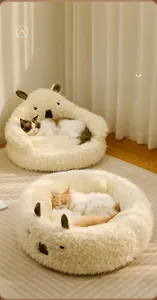 Detail of plush koala-shaped pet bed with soft faux fur and cute animal features