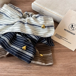 Retro striped scrunchies set with golden heart charms in beige, navy, and coffee brown