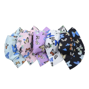 Reversible butterfly print bucket hats in five colors: blue, pink, purple, white, and black