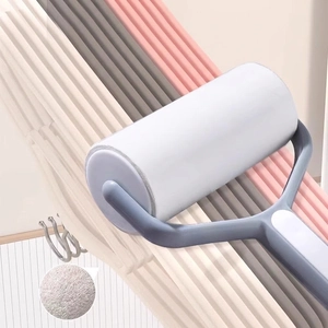 Non-slip flocked clothes hangers in multi-colors with a blue lint roller for home care
