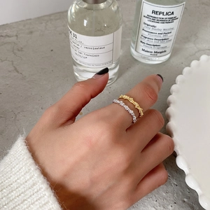 Irregular bubble textured S925 sterling silver rings in gold and silver on hand
