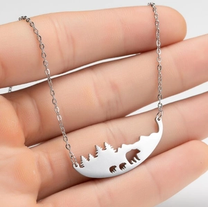 Stainless steel necklace with bear family mountain silhouette pendant on cross chain