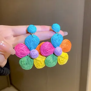 Colorful woven flower drop earrings featuring vibrant summer bohemian dopamine style