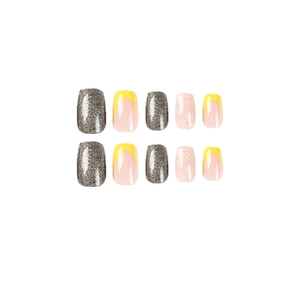 Yellow French press-on nails set with glitter accents and small daisy flower designs