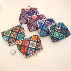 Detail view of colorful bohemian pattern canvas coin purses with vintage metal clasps