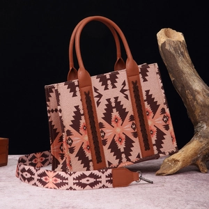 Close-up of ethnic woven pattern on cotton linen tote with brown faux leather straps