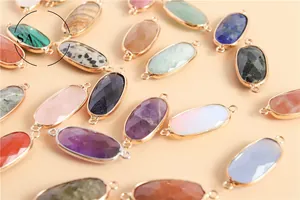 Macro shot of oval faceted crystal connector charms in assorted natural gemstones