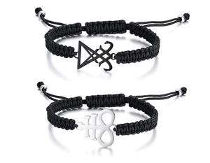 Close-up of black braided bracelets with Sigil of Lucifer and Leviathan Cross charms