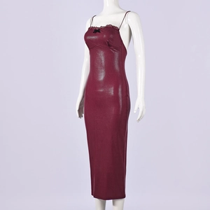 Detail of red snake-print dress with black lace trim and bow on the neckline