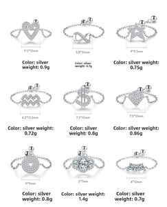 Macro view of nine S925 sterling silver chain rings with heart and star zircon designs