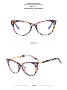 Detail view of cat eye glasses frames with vibrant floral patterns and golden metal temples
