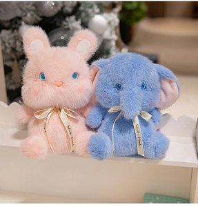Detail of plush pink bunny and blue elephant toys with Wendy Friends ribbons