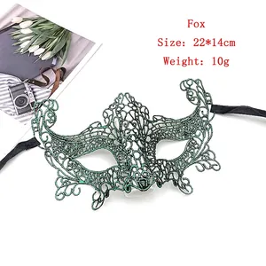 Detail view of a green lace fox mask with golden embroidery for Halloween cosplay