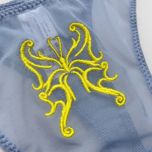 Blue mesh thong with intricate yellow butterfly embroidery and sheer breathable fabric