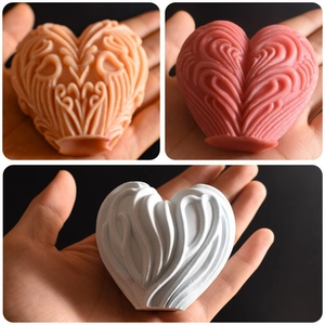 Textured heart-shaped silicone candle mold showing detailed embossed wavy patterns