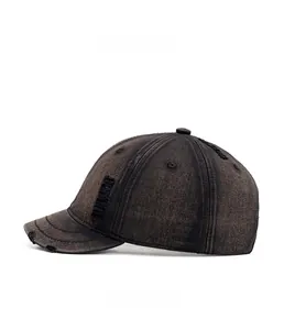 Side view of distressed vintage short brim baseball cap with worn edges and washed finish