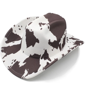 Detail of western cowboy hat with cow print pattern and felt texture finish
