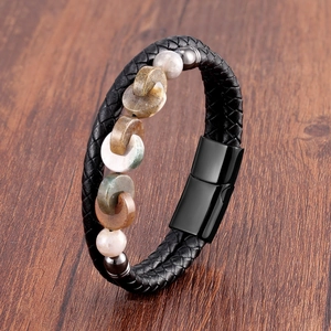 Detail of double-layer black braided leather bracelet with stone beads and magnetic clasp
