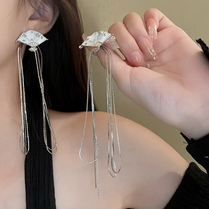 Elegant Chinese fan earrings with long tassels and gold edging on model