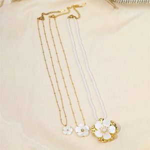 Golden stainless steel necklaces featuring white shell camellia pendants and pearls