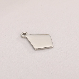 Close-up of diamond-shaped mirror polished stainless steel pendant for jewelry DIY