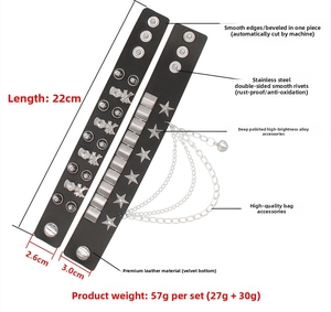 Detail of punk black PU leather wide bracelets with skull studs and metal chains