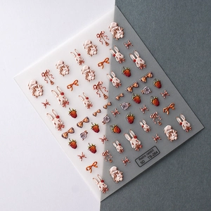 Detail of 5D embossed nail stickers featuring vintage rabbits, bows, and flowers