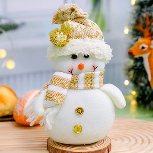 Plush Christmas snowman gnome doll on wooden base with festive holiday background