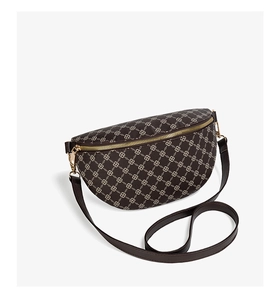Detailed close-up of dark brown monogram waist bag with crescent shape and gold hardware