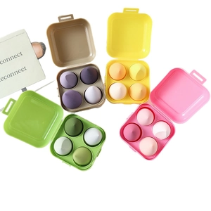 Set of ultra-soft makeup sponges in various colors with matching storage containers