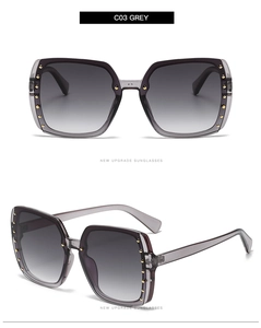 Close-up of grey square sunglasses with golden rivets and gradient lenses C03 GREY
