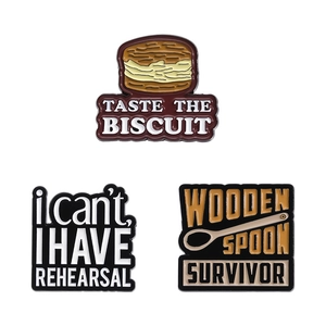 Funny enamel pin set featuring biscuit, wooden spoon survivor, and rehearsal quotes