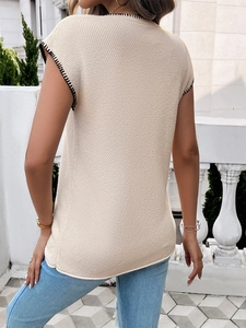 Detailed back view of a beige knitted sleeveless top with black stitching accents