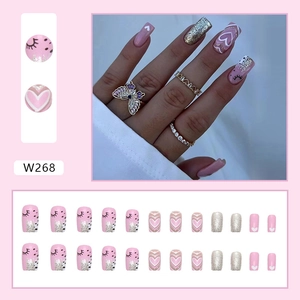 Pink press-on nails with silver glitter gradient and heart patterns, 24 pieces set