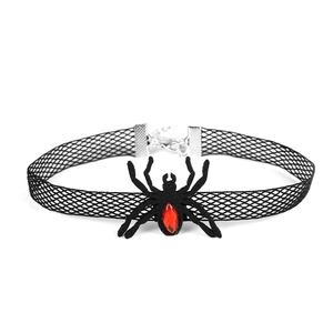 Gothic black lace choker featuring a spider charm with red gemstone on white backdrop