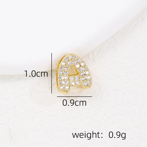 Macro shot of gold letter A pendant with cubic zirconia and size dimensions 1.0cm