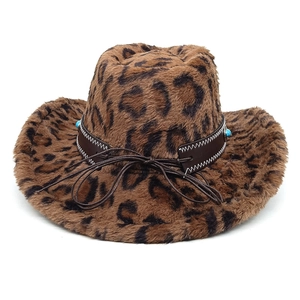 Close-up of leopard faux fur cowboy hat with leather band and blue beaded accents