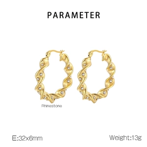 Detail of twisted gold earrings with rhinestones showing 32x6mm size and 13g weight
