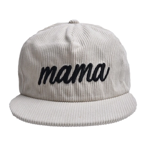 Detail of cream corduroy baseball cap with black MAMA embroidery and retro texture