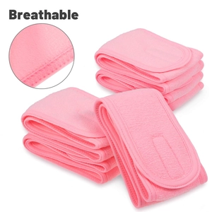 Detail of pink breathable towel fabric hairband showing soft texture and stitching