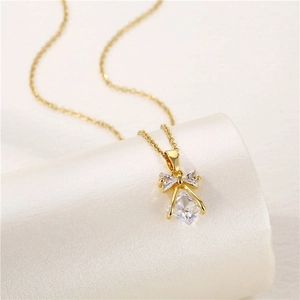 Elegant gold bow necklace with square zircon pendant on silk ribbon, chic jewelry gift