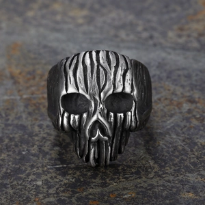 Vintage punk skull ring in antique silver finish with textured bark pattern on metal band