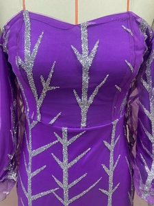 Close-up of silver branch-patterned sequins on purple mesh fishtail evening dress