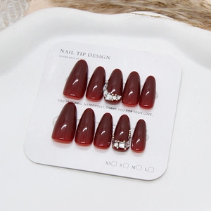 Vintage burgundy stiletto press-on nails with sparkling diamond and glossy finish