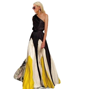 Detail of color-block pleated maxi dress with off-shoulder neckline in yellow and black